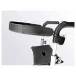 Trust Care Back Strap for Lets Fly and Lets Go Out — black padded fabric back strap with embossed Trust Care logo on the right end, shown mounted between the upper handle rails of a rollator