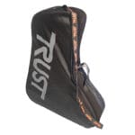 Trust Care Lets Fly Transport Bag — black canvas transport bag with grey TRUST logo printed on the front and orange Trust Care branded strap looping along the side