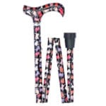 Classic Canes Foldable Crazy Cats Cane — partly folded showing the derby handle and shaft covered in a black background with colourful cats pattern in pink, red, purple and cream, with a small silver collar and a black rubber ferrule at one end