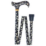 Classic Canes Foldable Swallows Cane — partly folded showing the derby handle and shaft covered in a navy background with cream swallows-in-flight pattern, a gold brass collar between handle and shaft and a black rubber ferrule at one end