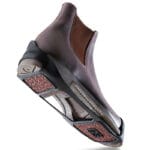 Brunngård SandyGrip ice grips Citysafe studless anti-slip shoe cover on brown Chelsea boot – chemical traction plates without metal studs