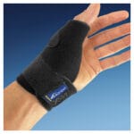 Black perforated neoprene NRX thumb orthosis worn on a hand with fingers free