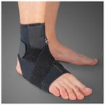 Black Mediroyal SRX ankle support worn on a foot with an elastic strap
