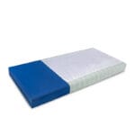 Etac Immedia SatinSheet 2D Midi fitted on a blue mattress with the white satin panel in the centre