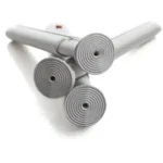 Etac Swift rubber tips 4-pack — four grey rubber tips with ridged grip pads on white shower-stool legs