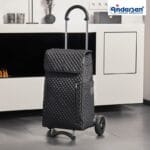 Andersen Scala Lissa - black, in use Person with the black Andersen Scala Lissa shopping trolley