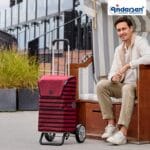 Andersen Alu Star Jelke - bordeaux, in use Person with the bordeaux Andersen Alu Star Jelke shopping trolley
