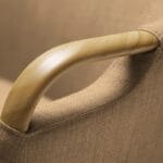 Trust Care Lets Sit Up - beige chair, armrest handle close-up Trust Care Lets Sit Up sit-to-stand chair in beige, armrest handle close-up