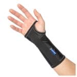 Mediroyal Ventus short wrist orthosis worn on the left wrist — black brace with hook-and-loop closure and Mediroyal logo
