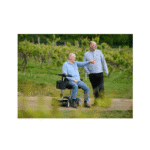 On a gravel path Man driving on a gravel path in a vineyard with a companion walking alongside