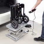 eFOLDi Lifter scooter lift eFOLDi Lifter scooter lift – folded electric scooter on the platform, operated with the remote control