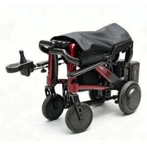The wheelchair folded to a compact format with battery pack and joystick