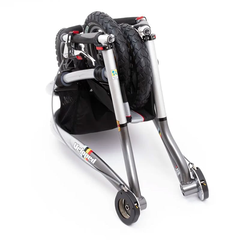 Folded Trionic Veloped with the wheels taken off and stacked against the frame