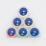 Six jars seen from above with lids showing the colour scale and article numbers