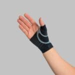 The brace seen from the palm Palm facing up with the brace on, the strap forming an arc around the thumb base