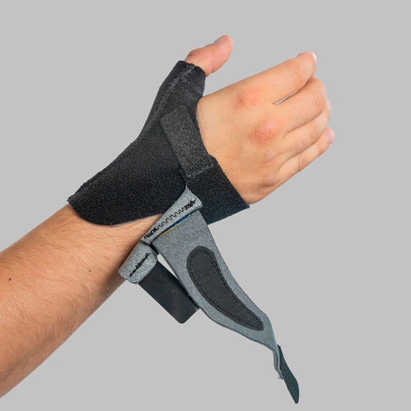 The brace on the hand with the grey strap undone and the hook visible