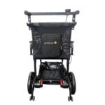 The wheelchair from behind Folded-out electric wheelchair seen from behind with the raised push bar fitted